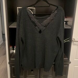 Black round neck sweater with lace crossover cut out in the back